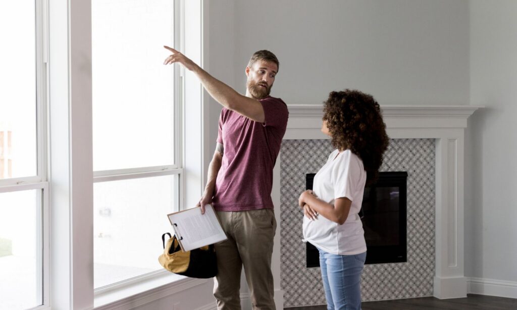 Buyer and Realtor reviewing an inspection report together